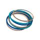 Conjunto de sete pulseiras, tipo escrava. 3 pulseiras em metal dourado e 4 em metal revestidas com fios de algodão em tons de azul