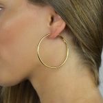 Argolas douradas em em aço fashion